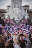 Fans gathered at a Riverside park waving British flags during a community event.