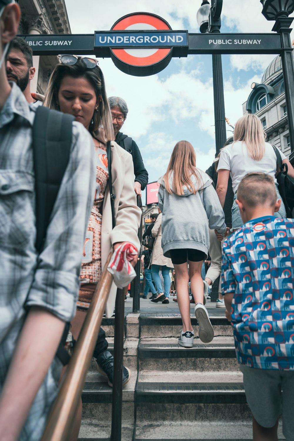 a group of people walking down a set of stairs