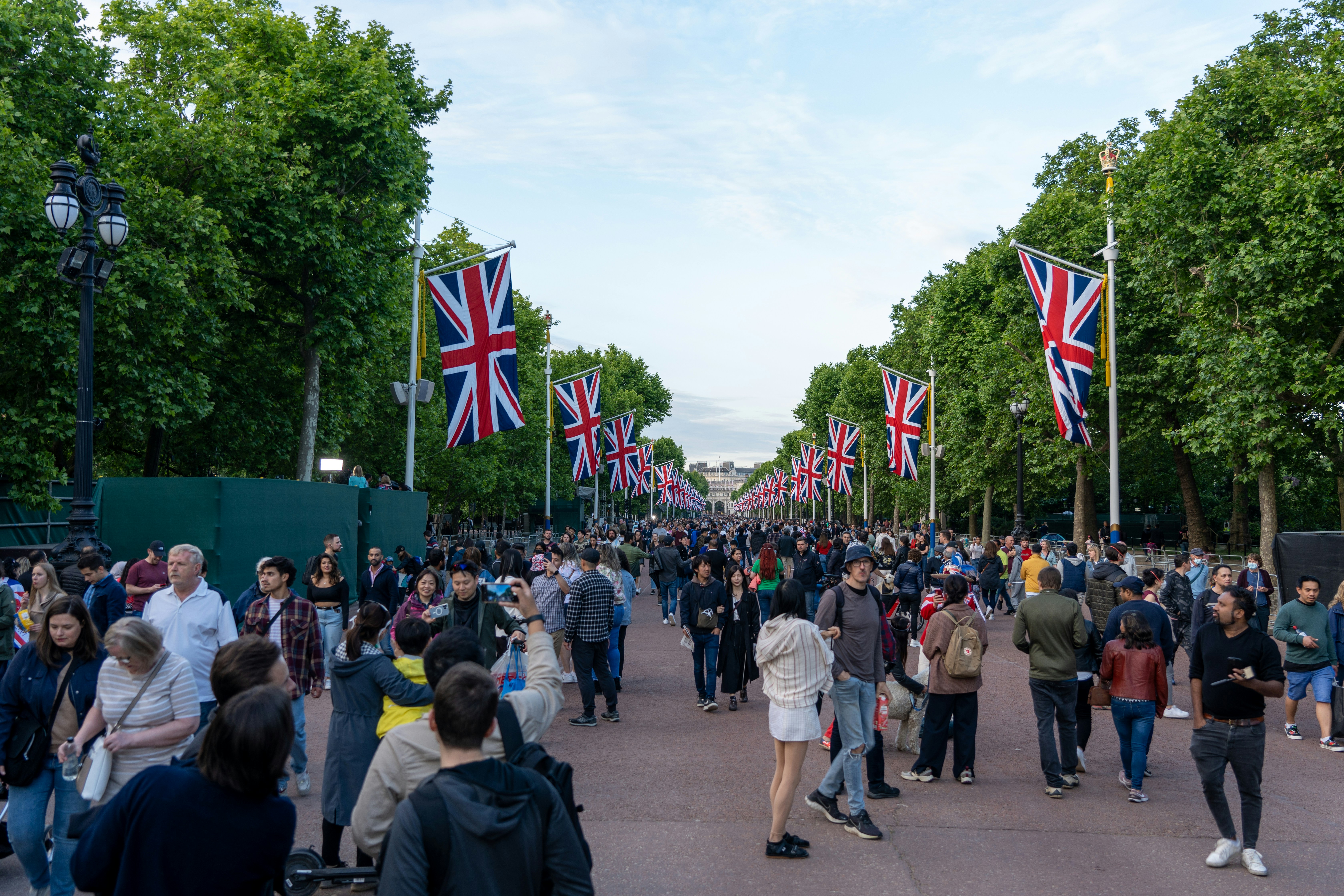 a large group of people walking down a street