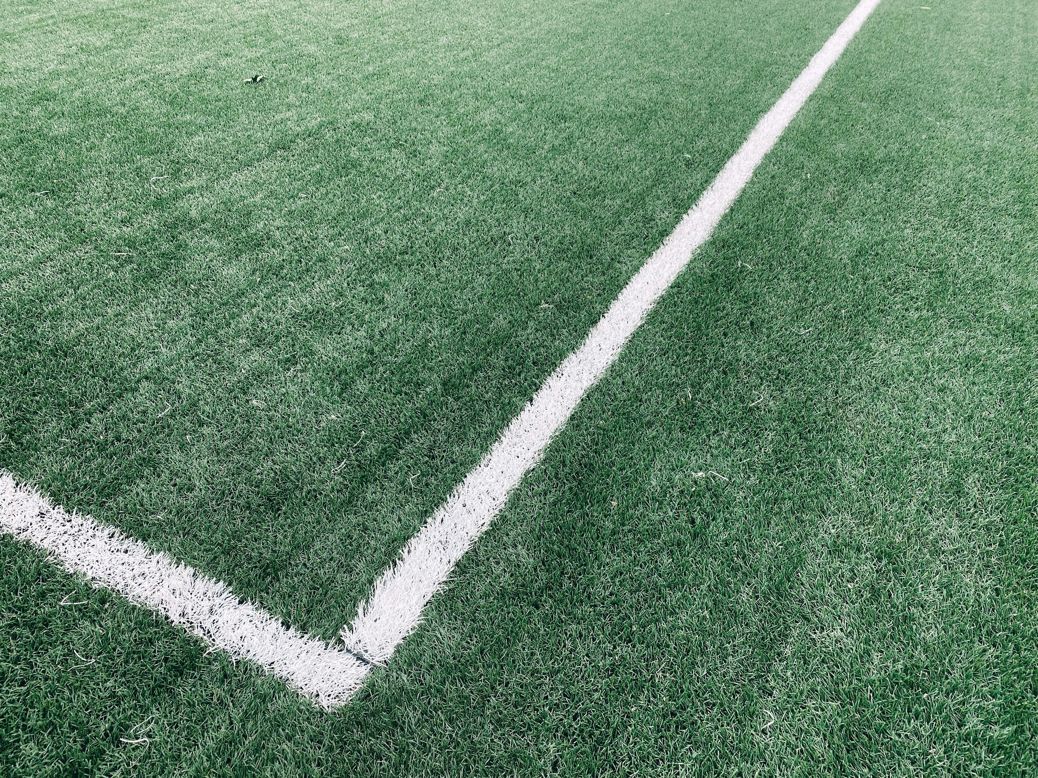 a soccer field with a white line painted on it
