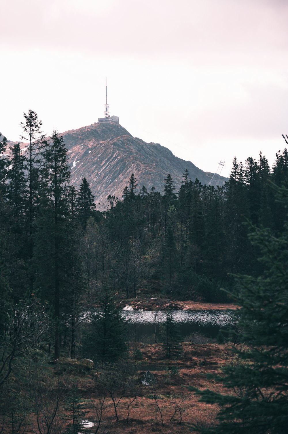 a view of a mountain with a lake in the foreground