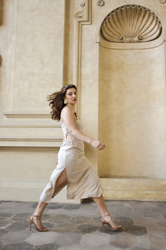 a woman in a white dress is running