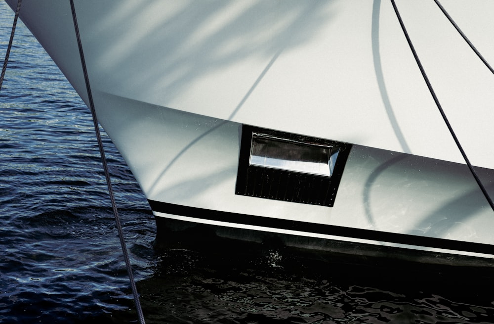 a large white boat is docked in the water