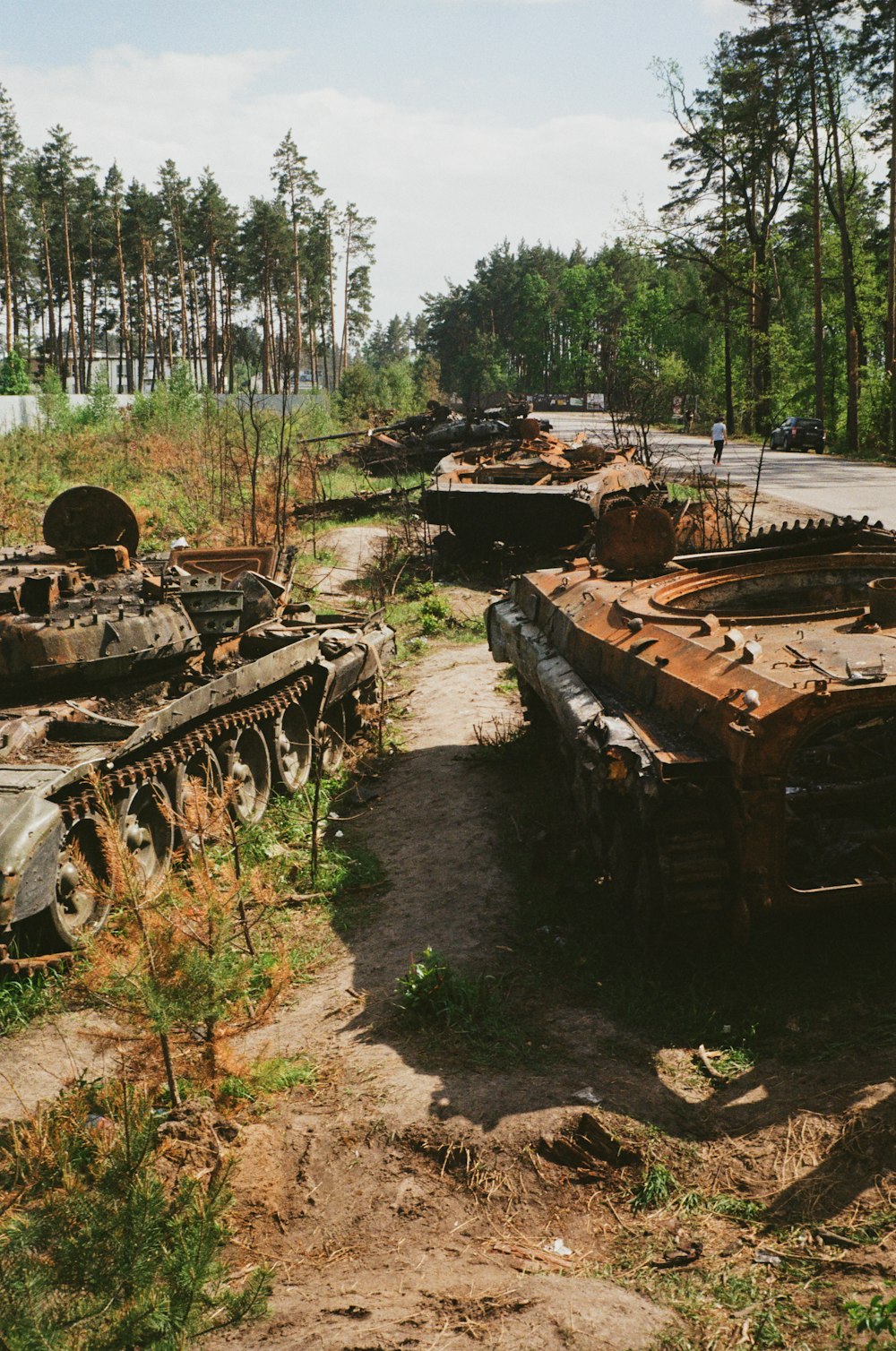 a couple of tanks that are sitting in the dirt