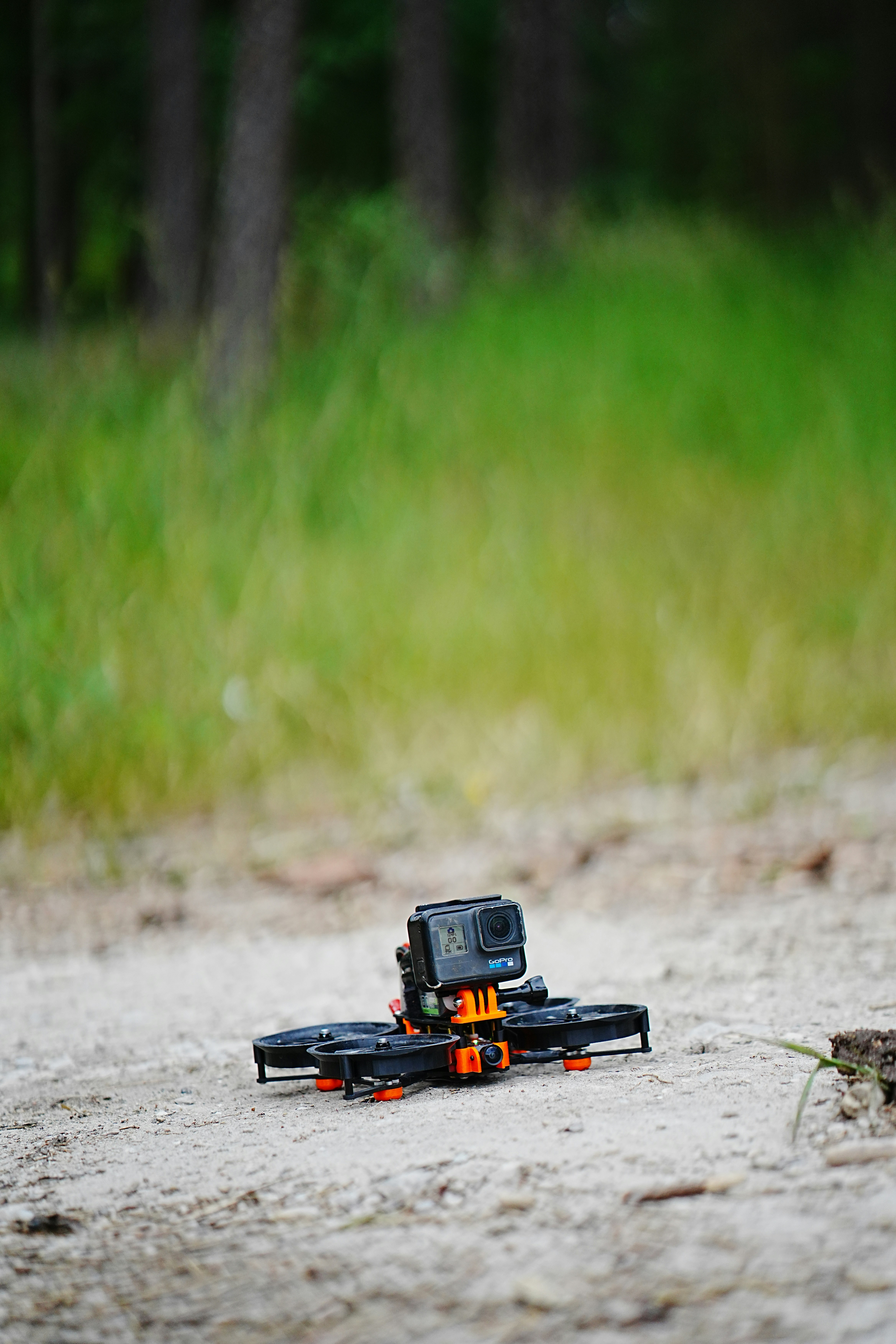 a remote controlled vehicle on a dirt road