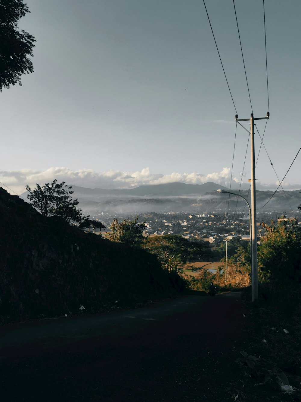 a view of a city from the side of a hill