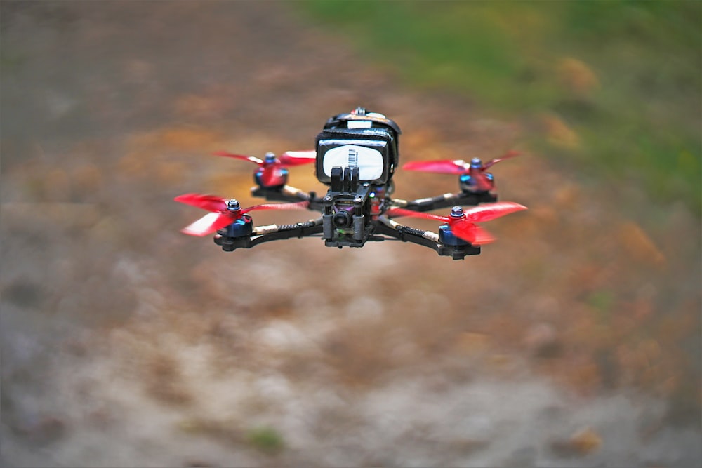 a red and black remote controlled flying device