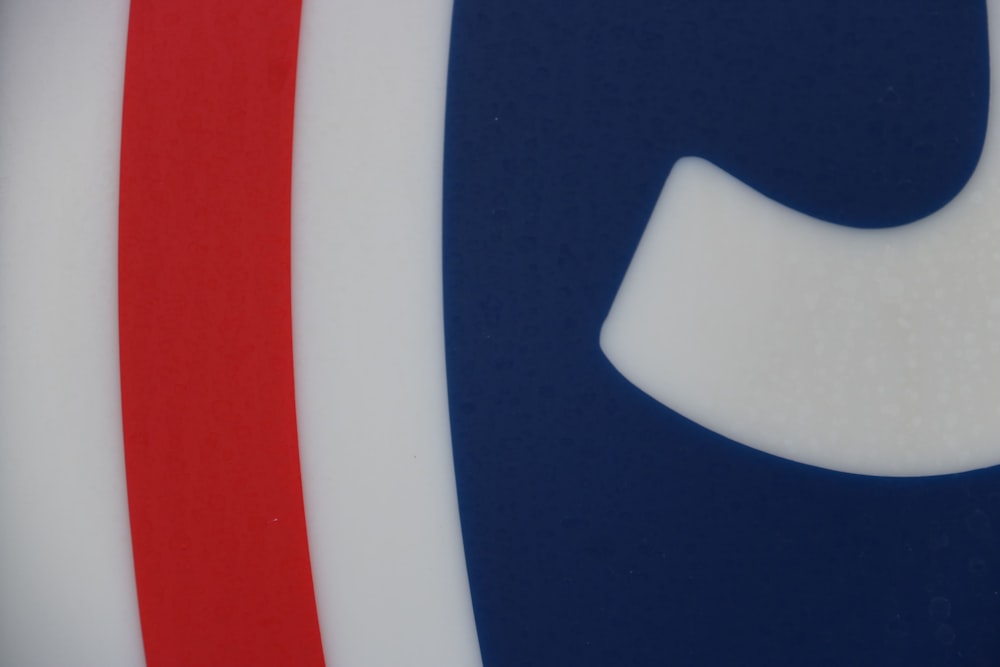 a close up of a red, white and blue logo