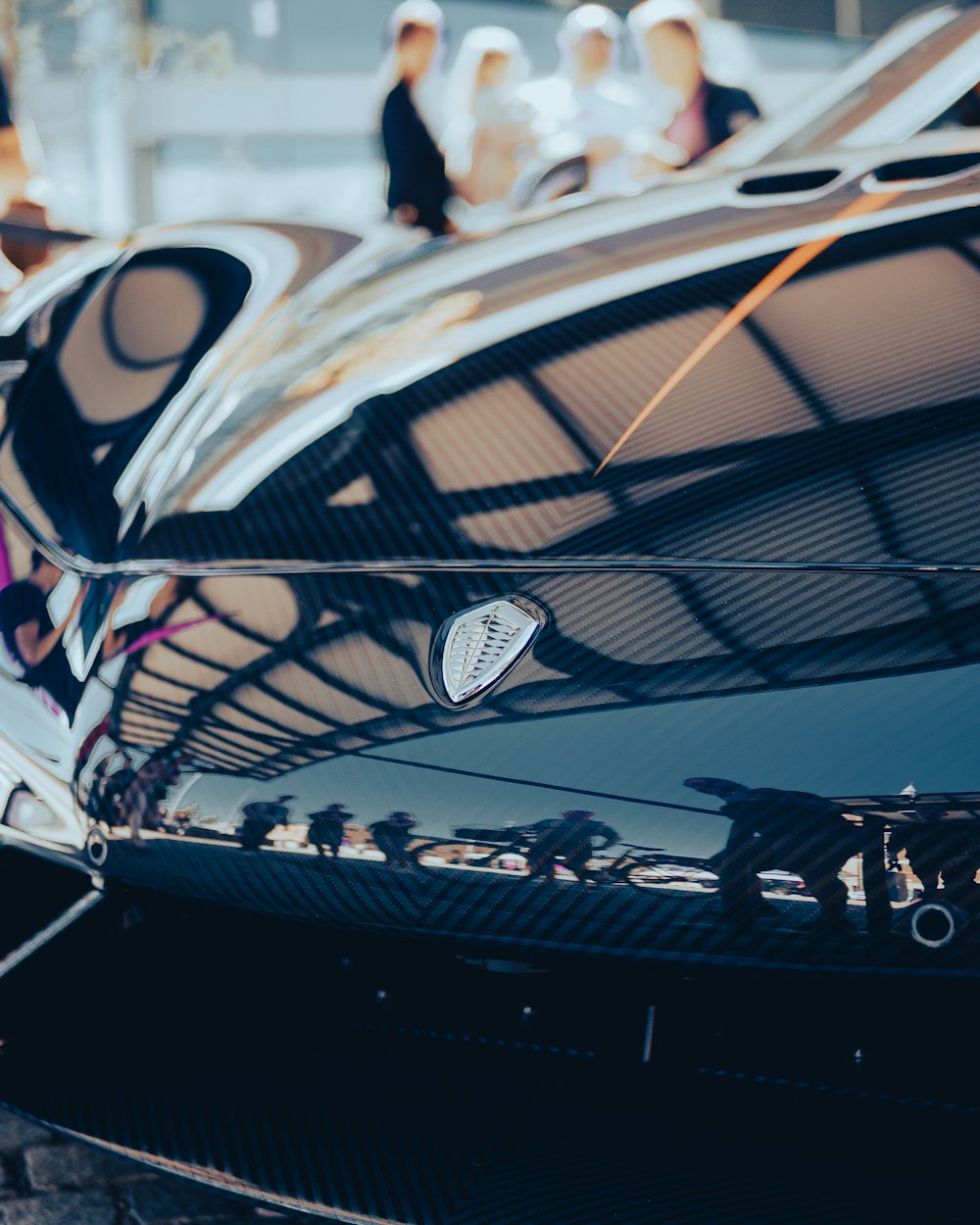 a close up of the hood of a sports car