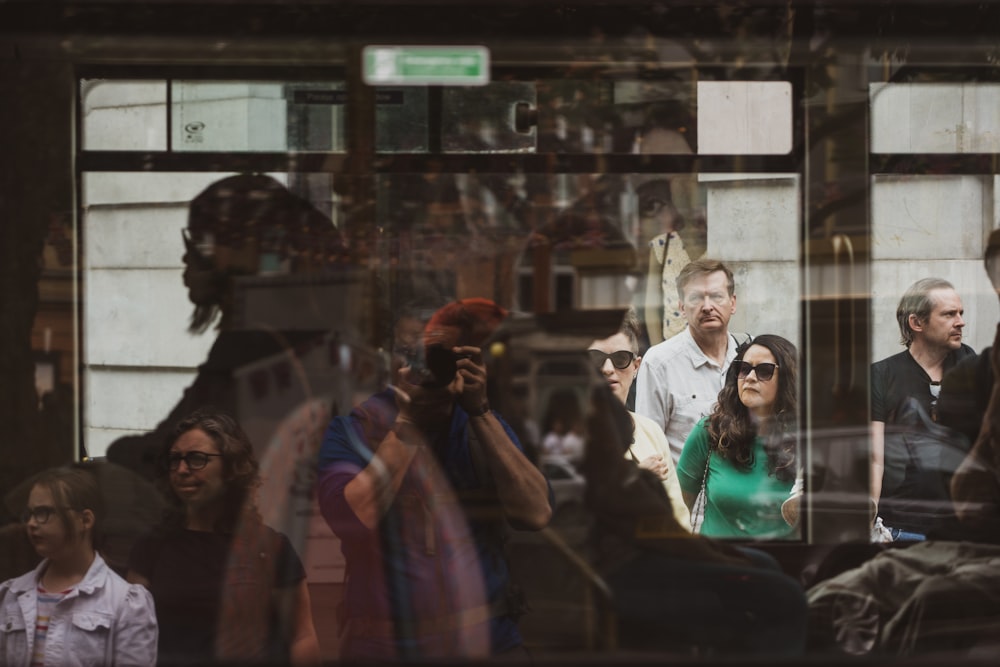 a group of people standing outside of a building