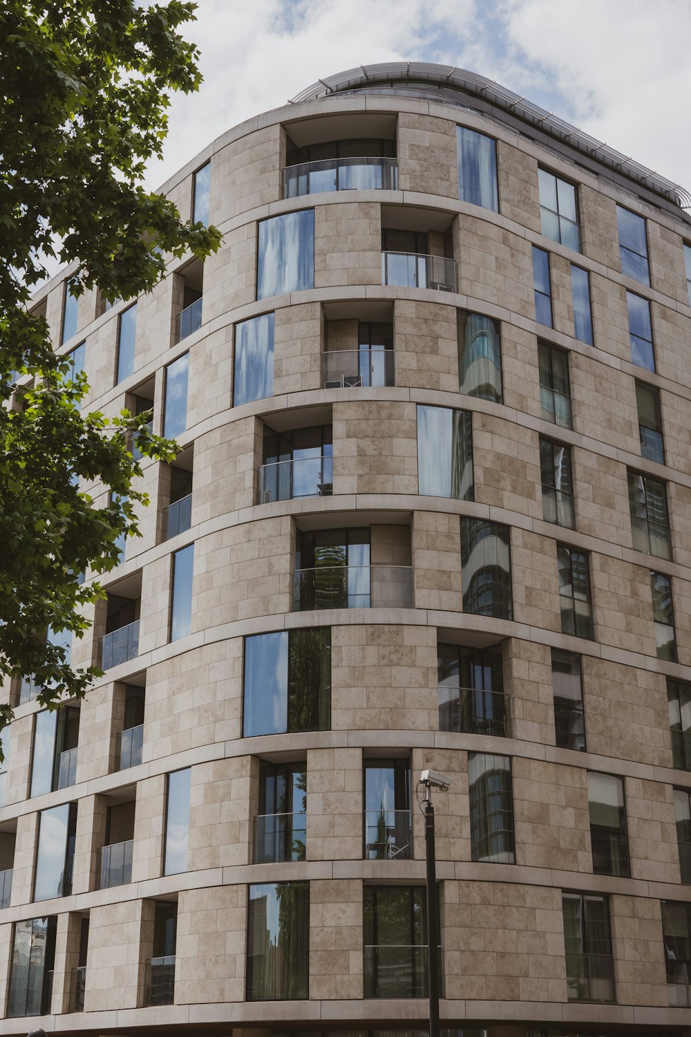 a tall building with many windows on the side of it