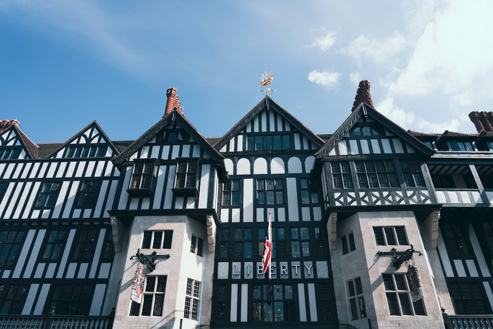 a large building with many windows and a flag on top of it