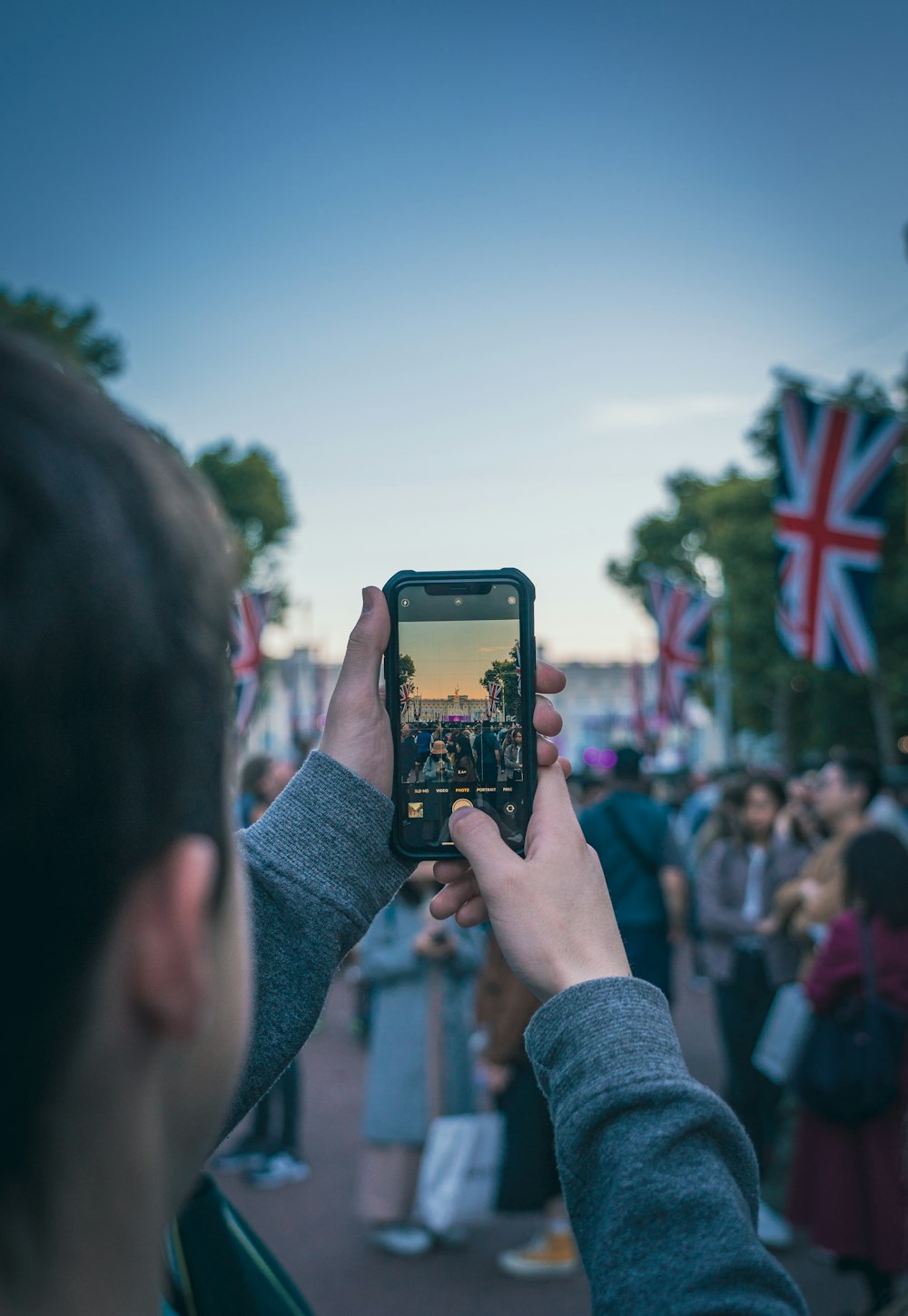 a person taking a picture with a cell phone