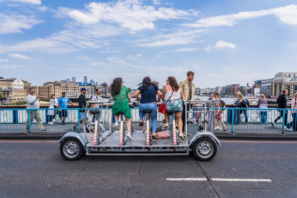 a group of people standing on the back of a truck