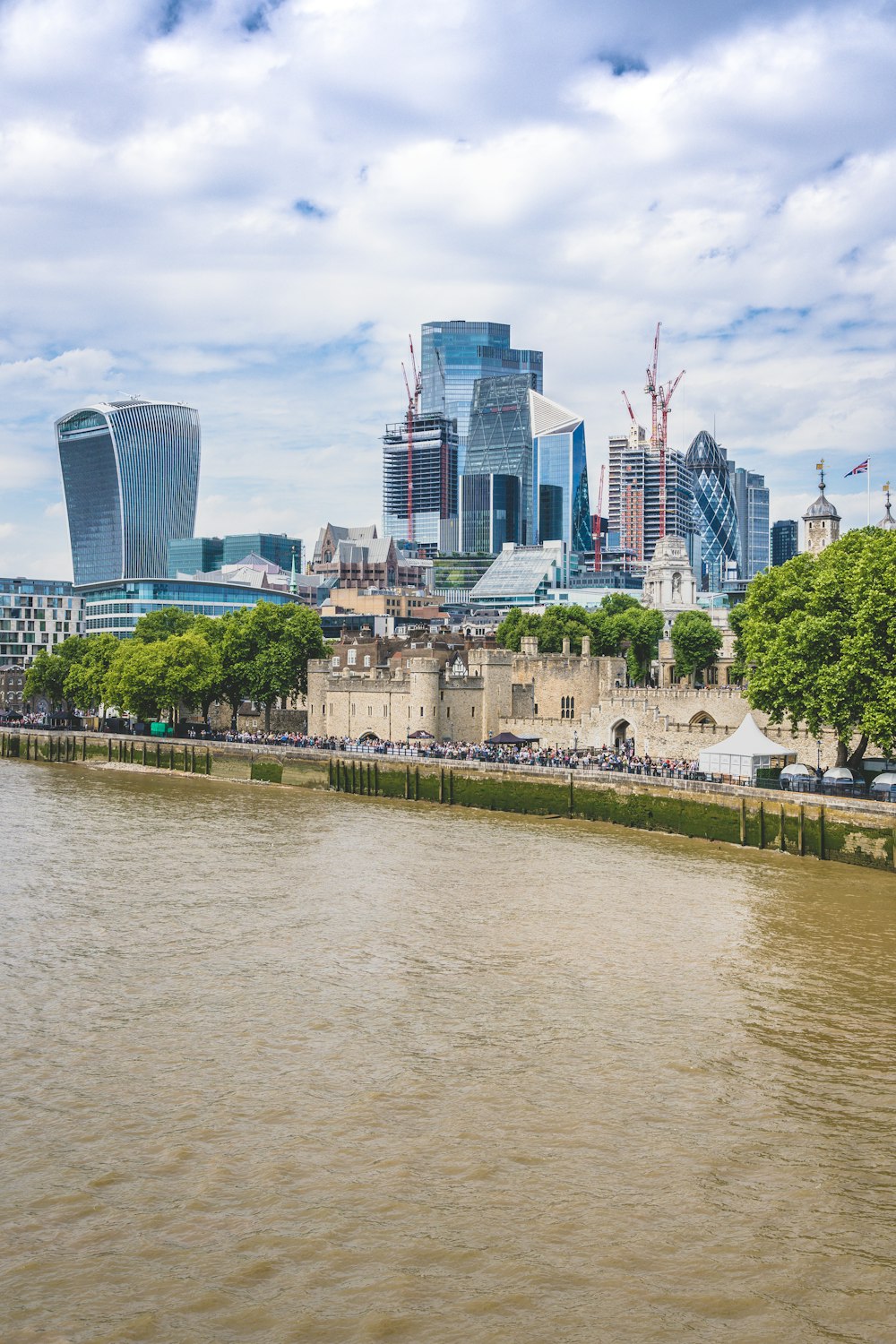 a body of water with a city in the background