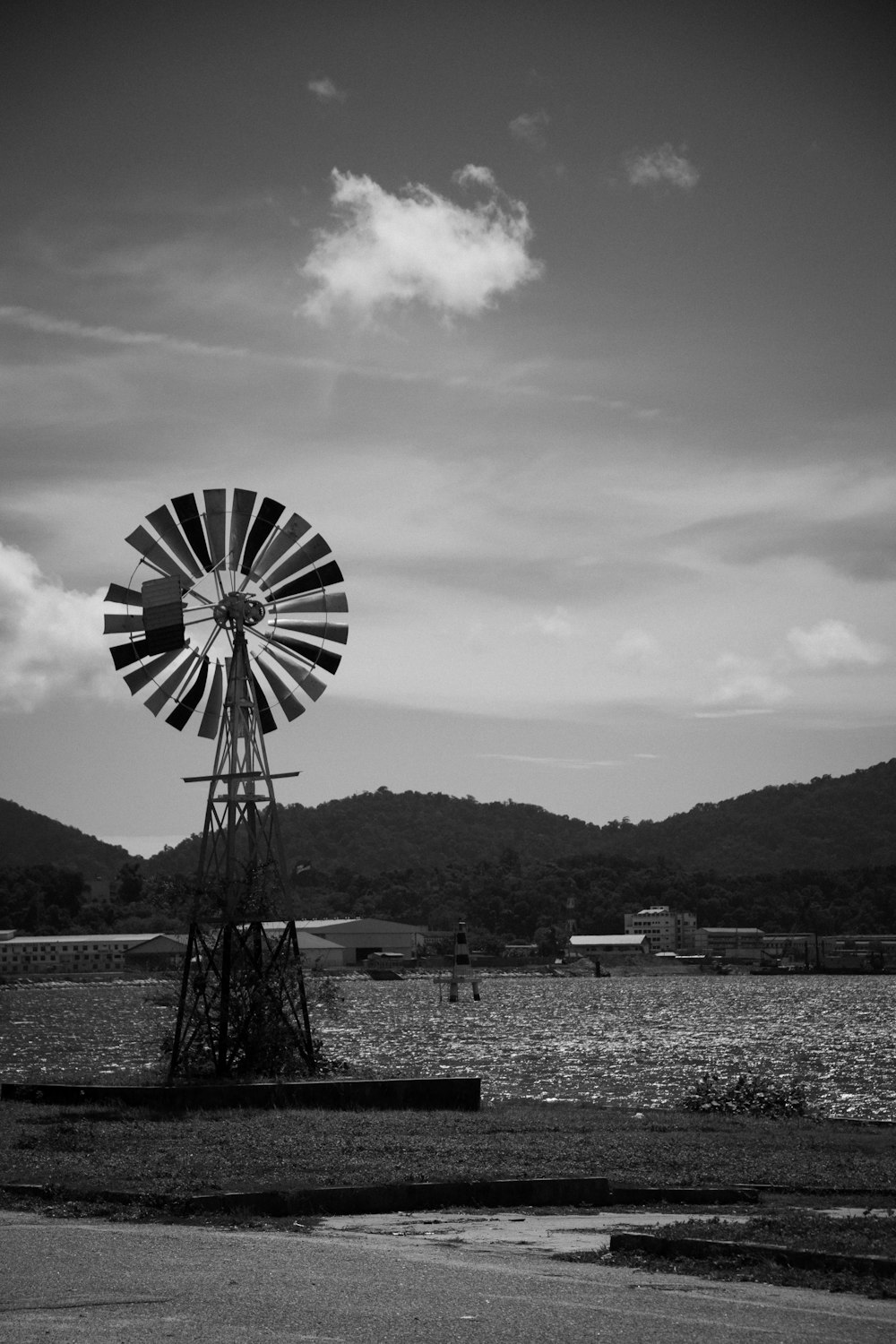 a black and white photo of a windmill