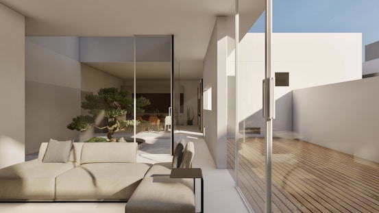 a white couch sitting on top of a wooden floor