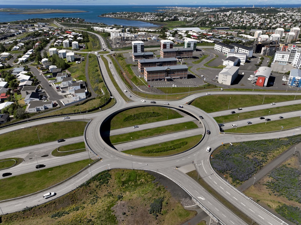 an aerial view of a highway intersection in a city