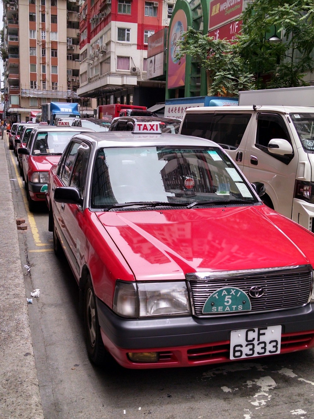 a row of parked cars on a city street