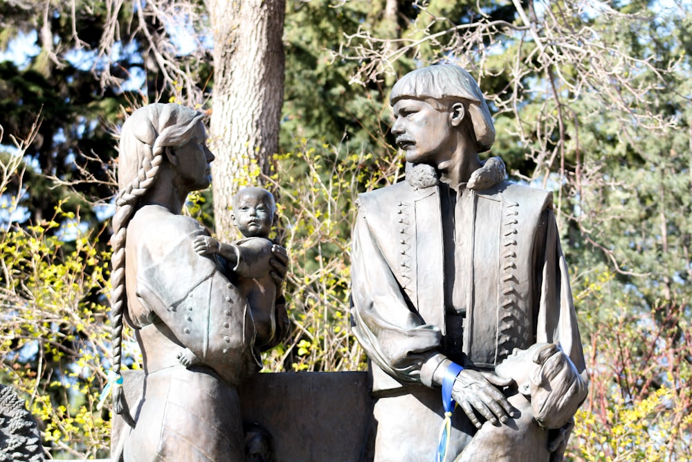 a statue of a man holding a child