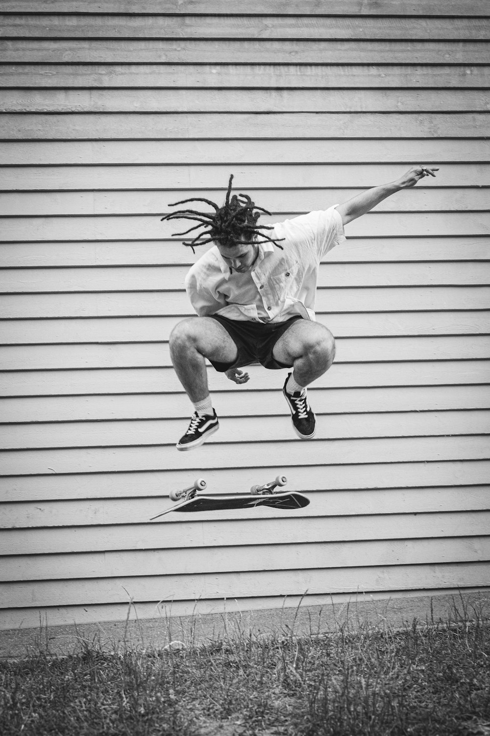 a man flying through the air while riding a skateboard