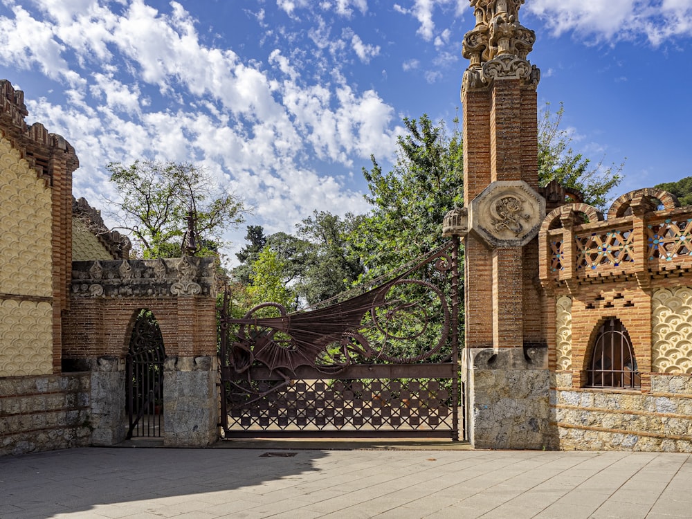 a large gate with a clock on the top of it