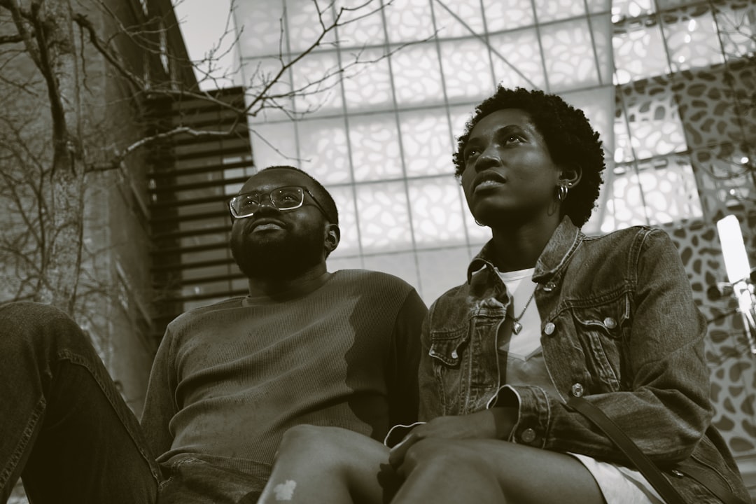 a couple of people sitting next to each other, The visionaries