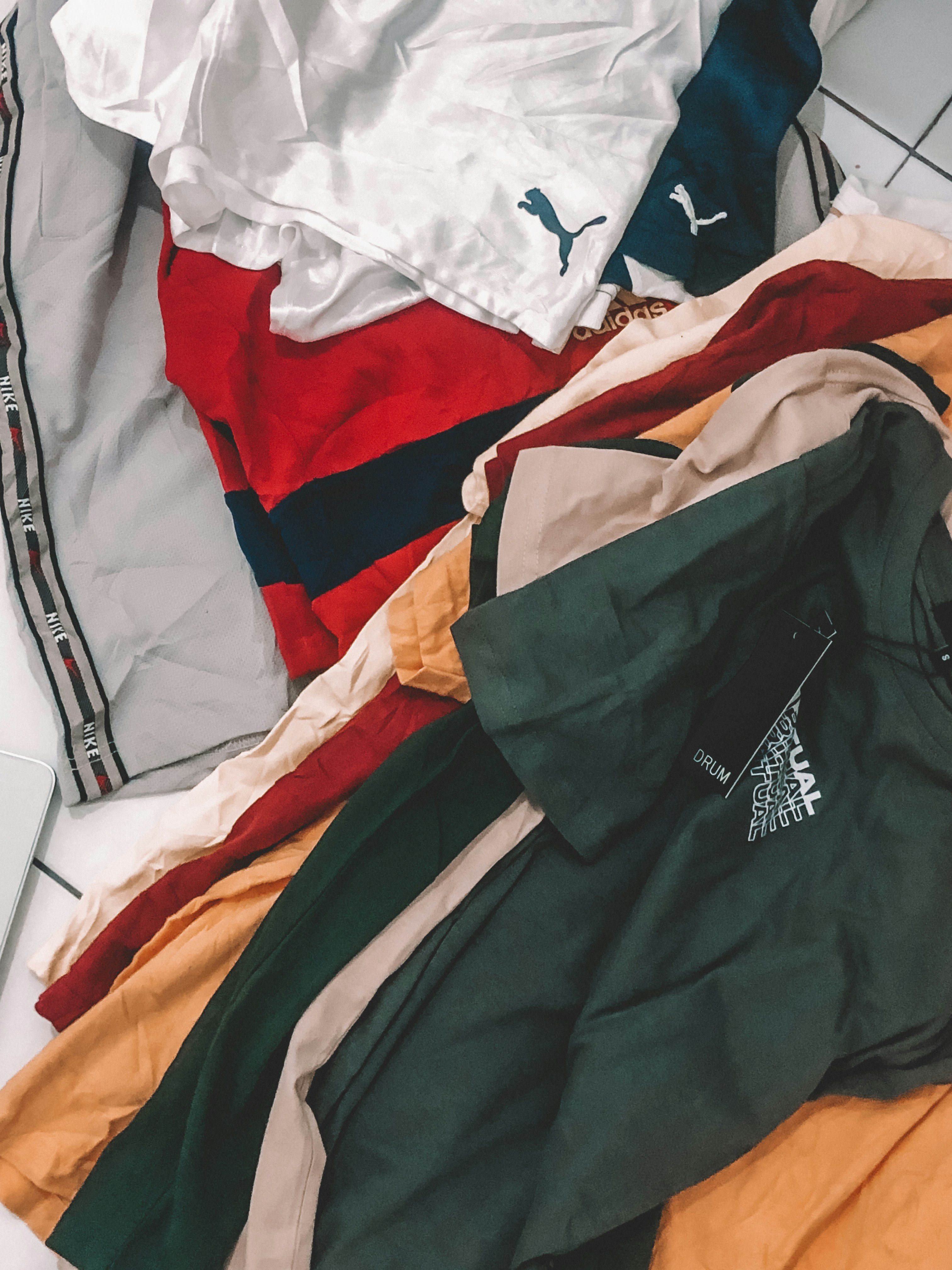 Stack of white custom branded t-shirts