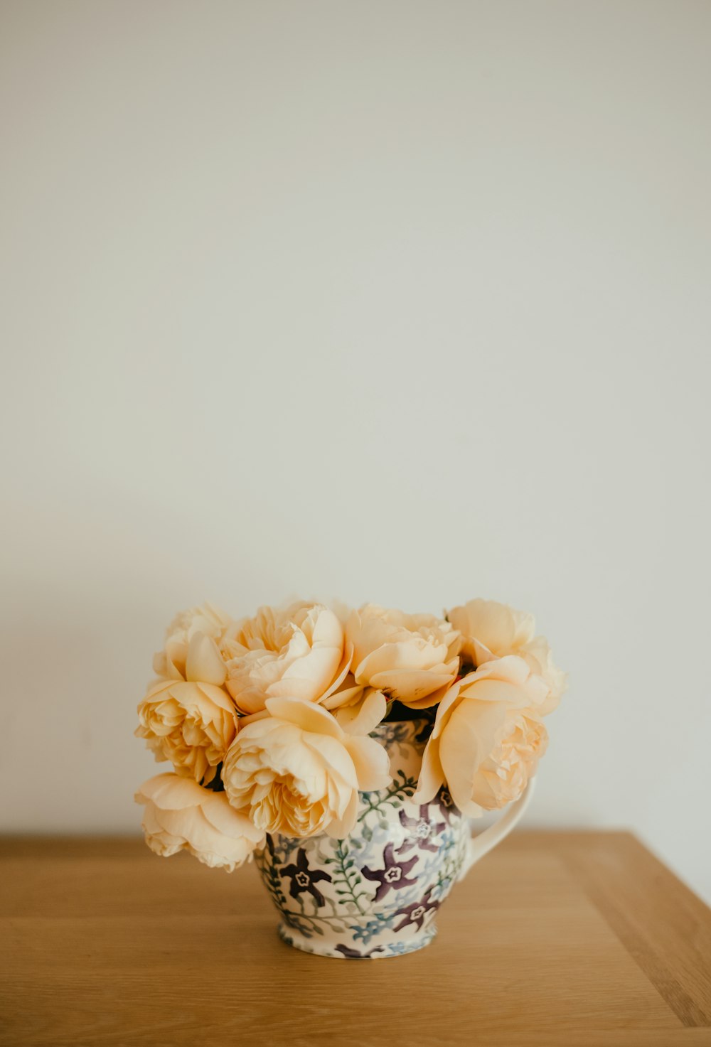 a bouquet of flowers in a vase on a table