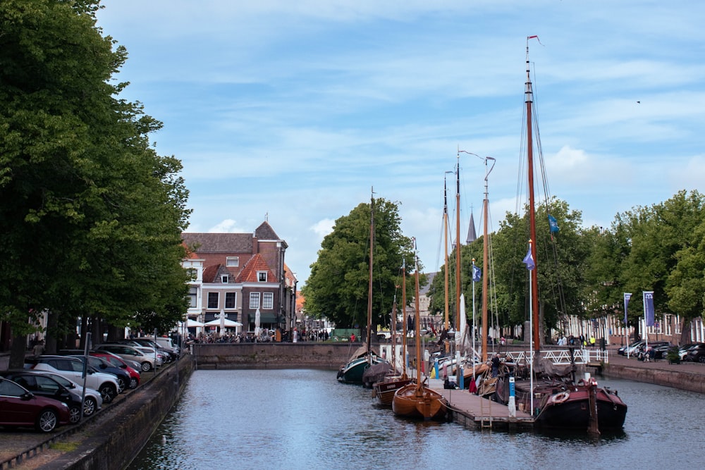 several boats are docked in the water near a city