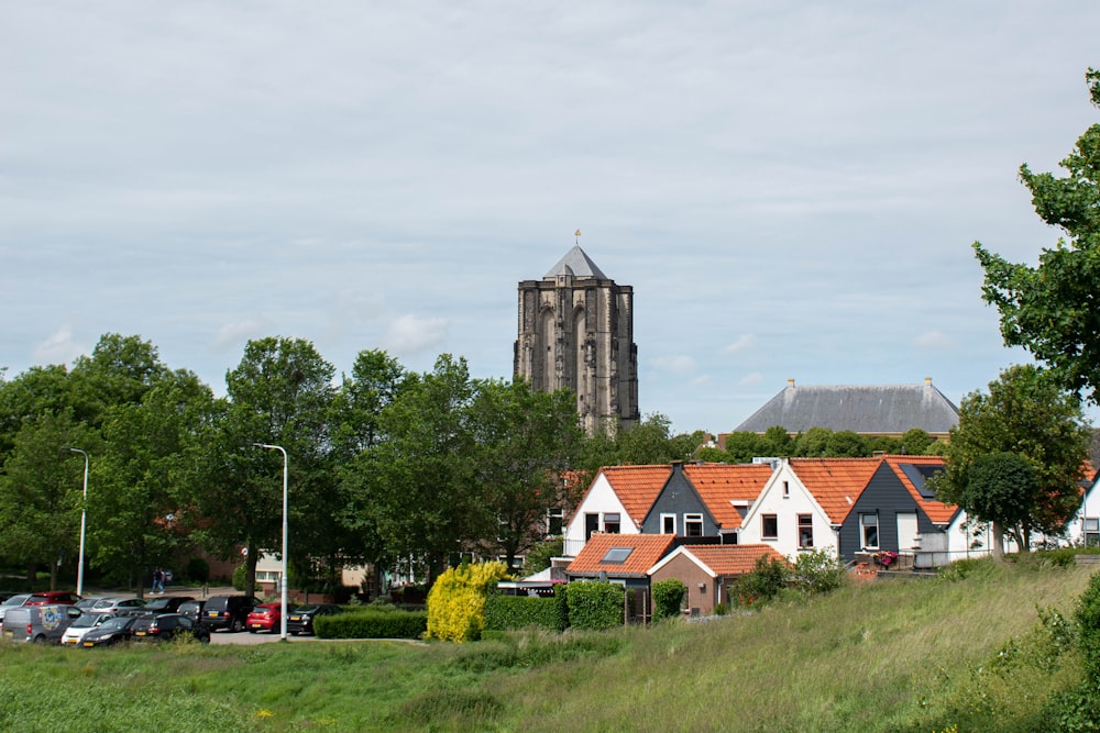 a row of houses with a church in the background