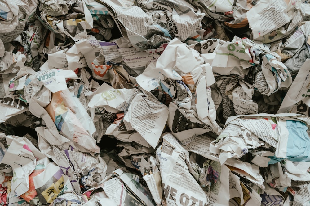 a pile of newspaper with a lot of paper on top of it