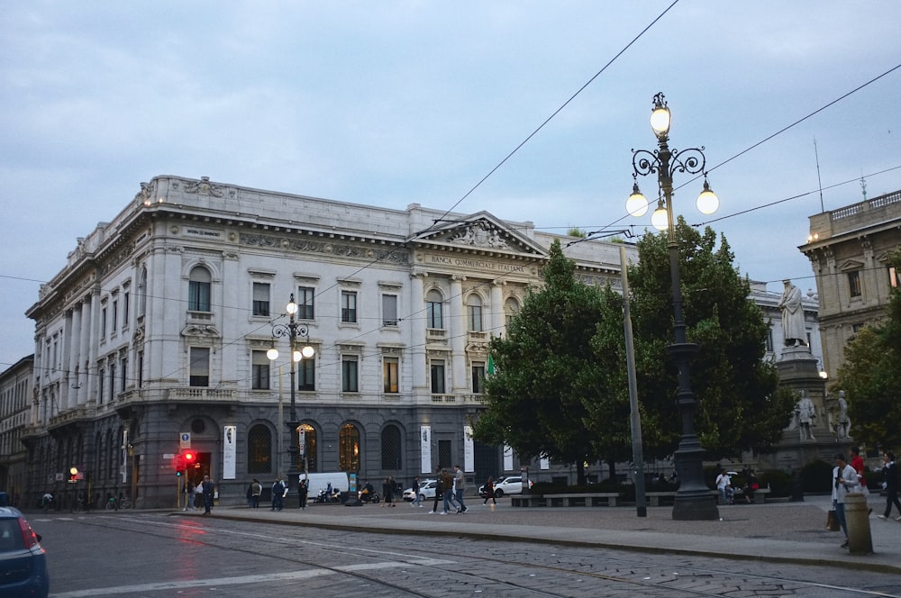 a street corner with a building and a red traffic light