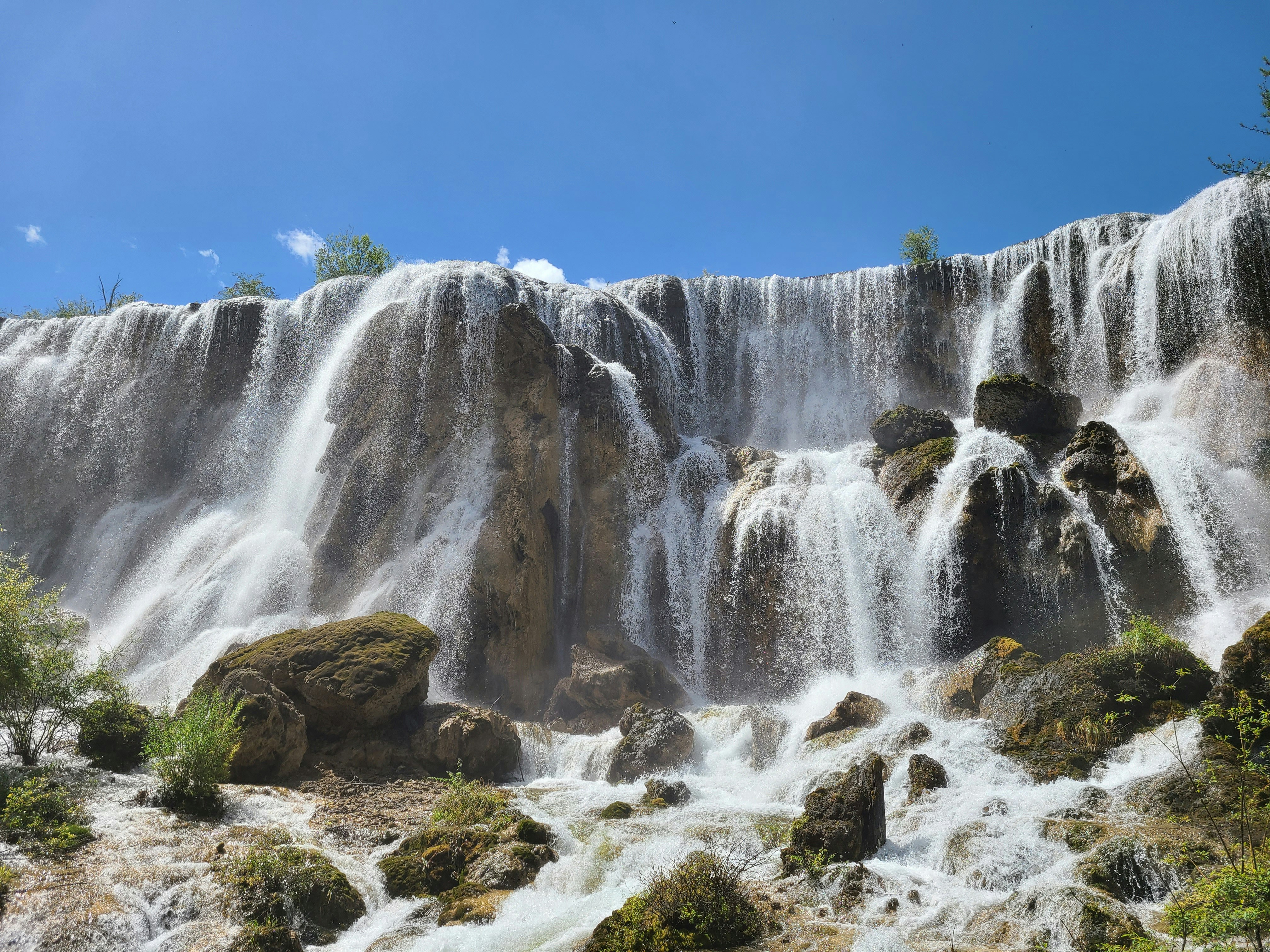 a large waterfall with lots of water coming out of it