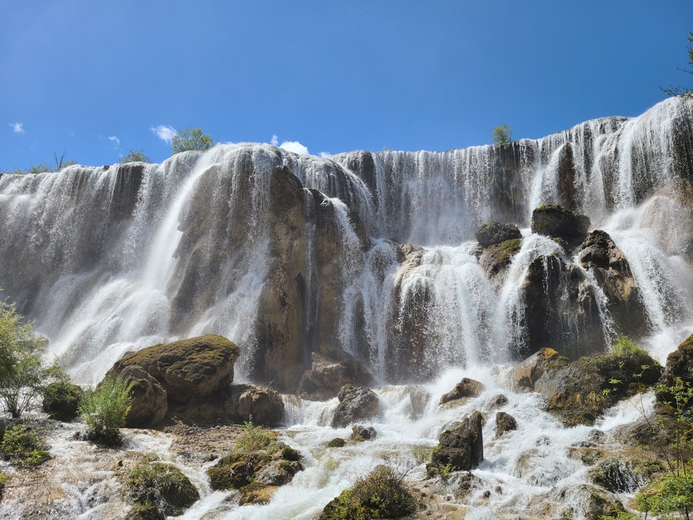 a large waterfall with lots of water coming out of it