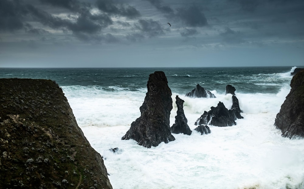 a large body of water surrounded by rocks