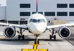 a large jetliner sitting on top of an airport tarmac