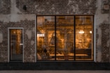 a brick building with a large glass window