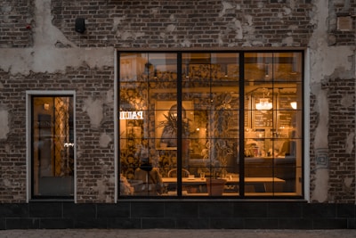 a brick building with a large glass window