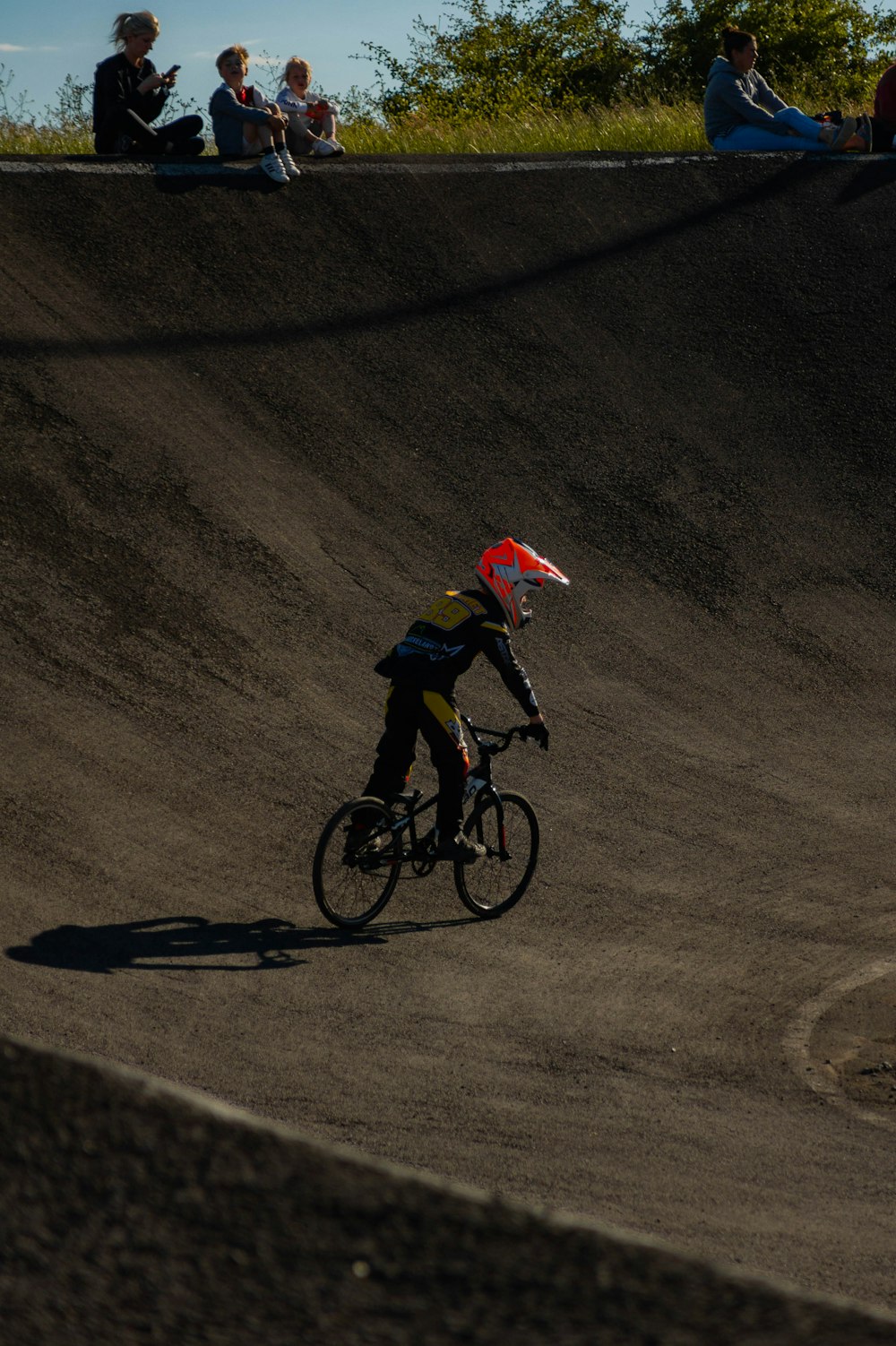 a person riding a bike down a hill