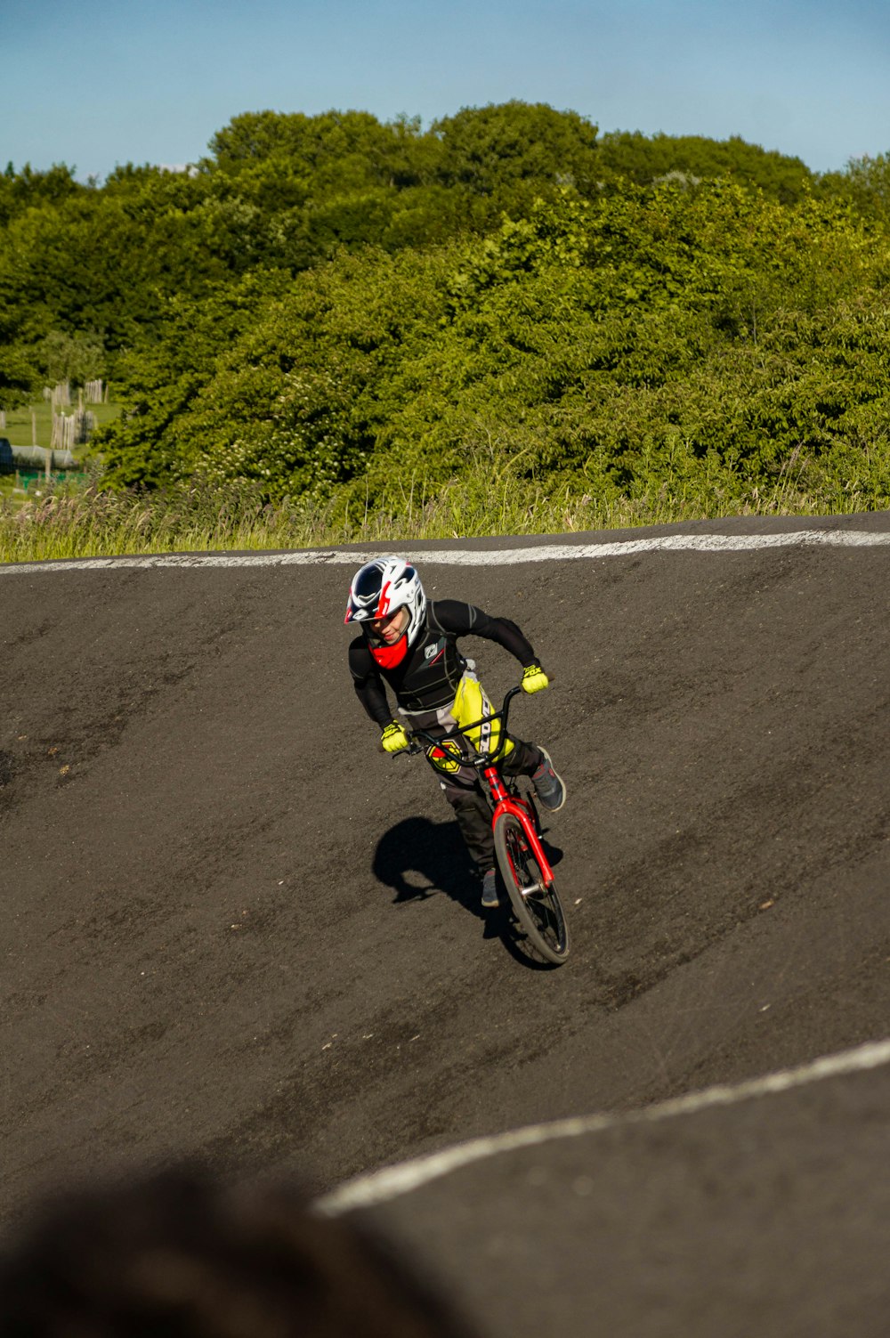 a man riding a dirt bike on a race track