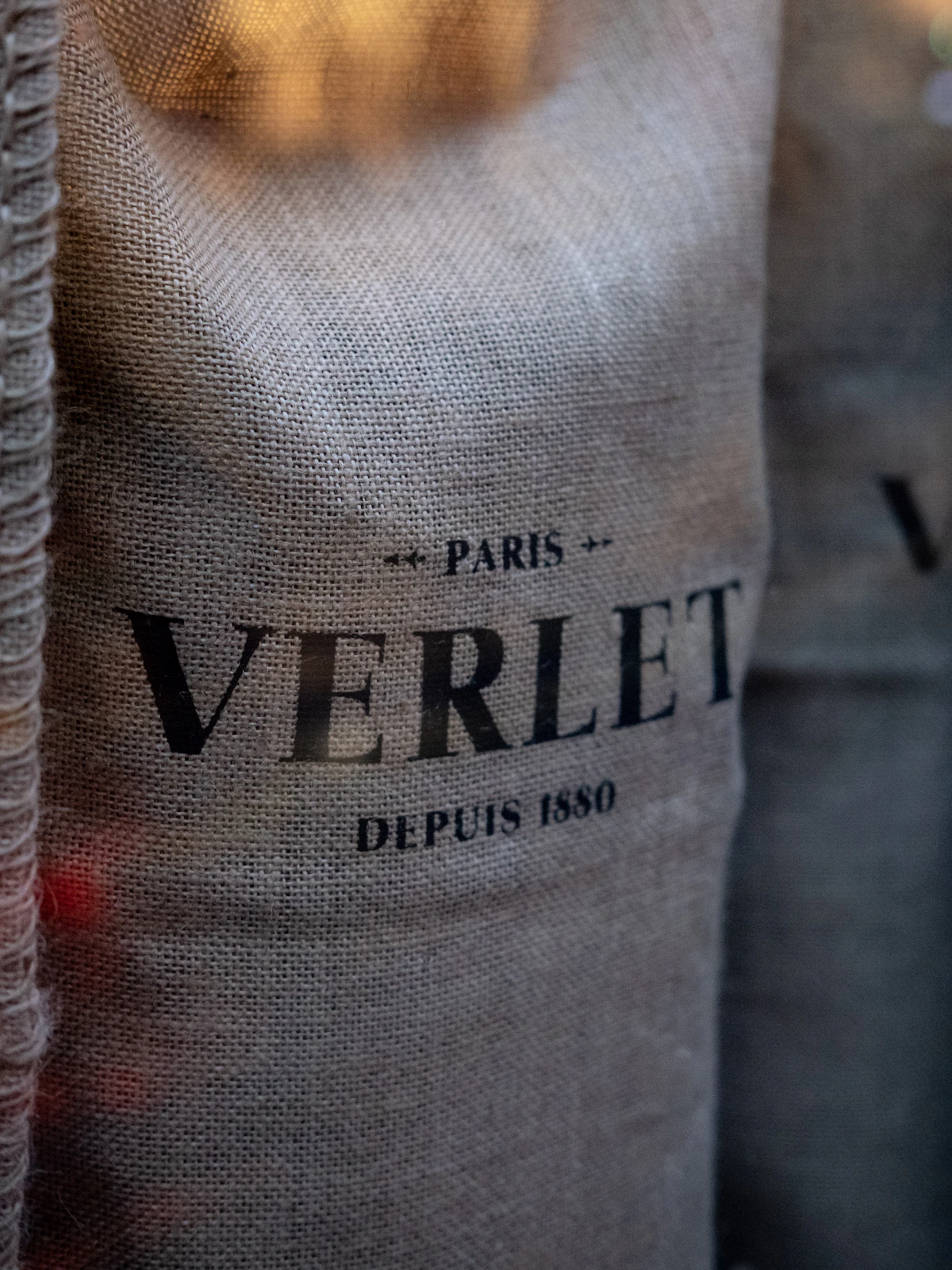 Natural cotton seed bags displayed in a retail garden shop setting