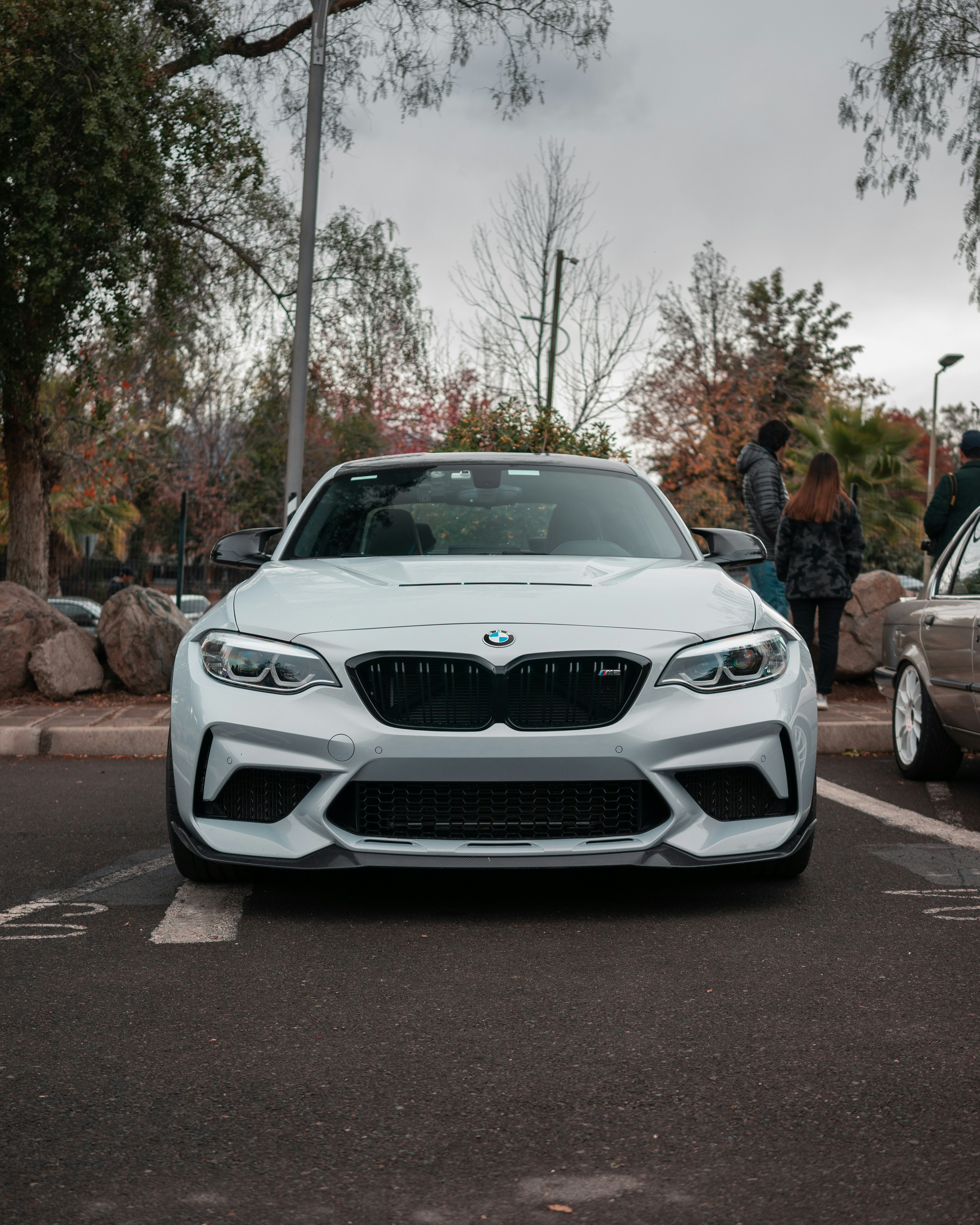a white car parked in a parking lot