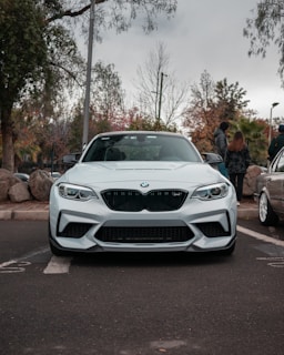 a white car parked in a parking lot