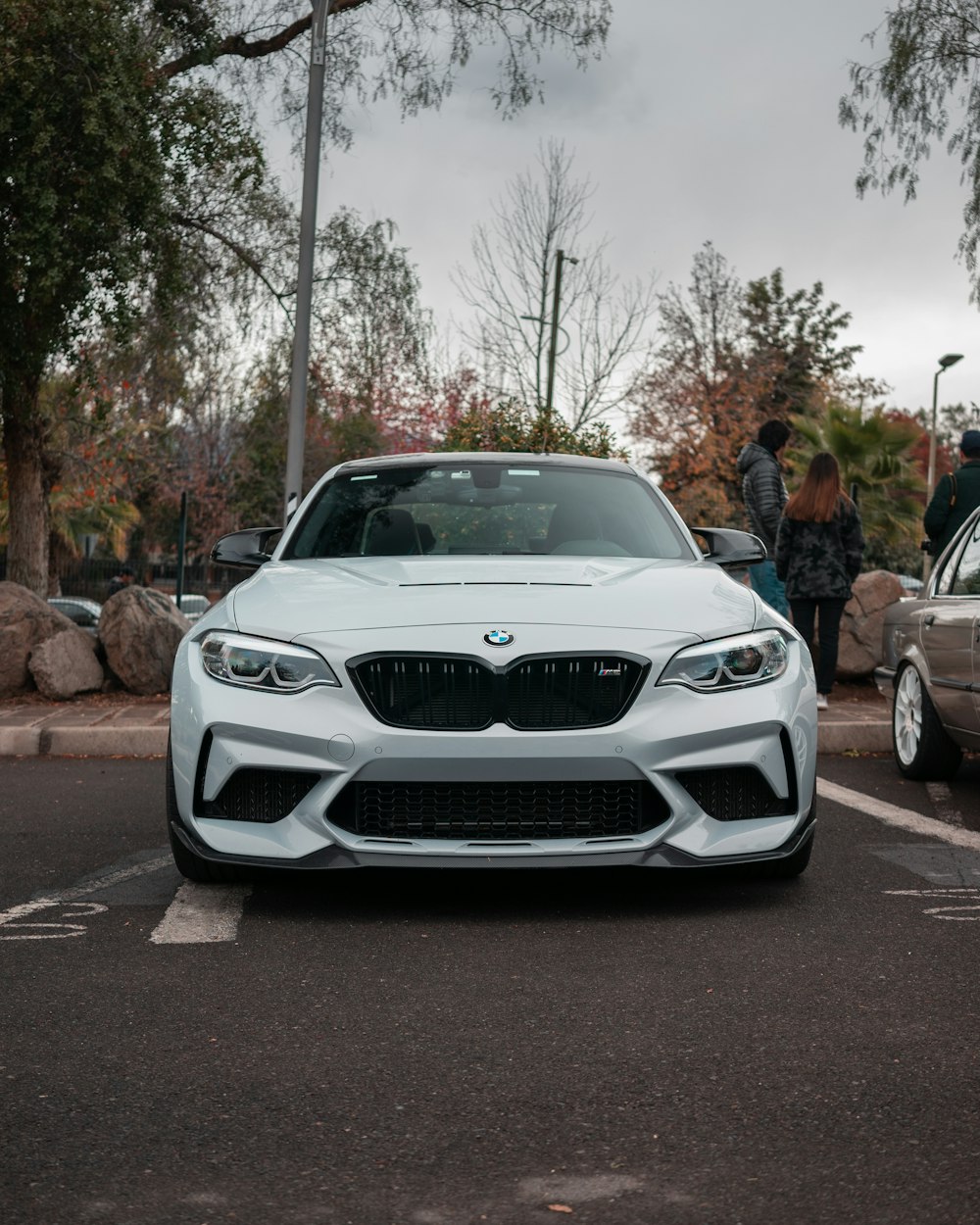 a white car parked in a parking lot