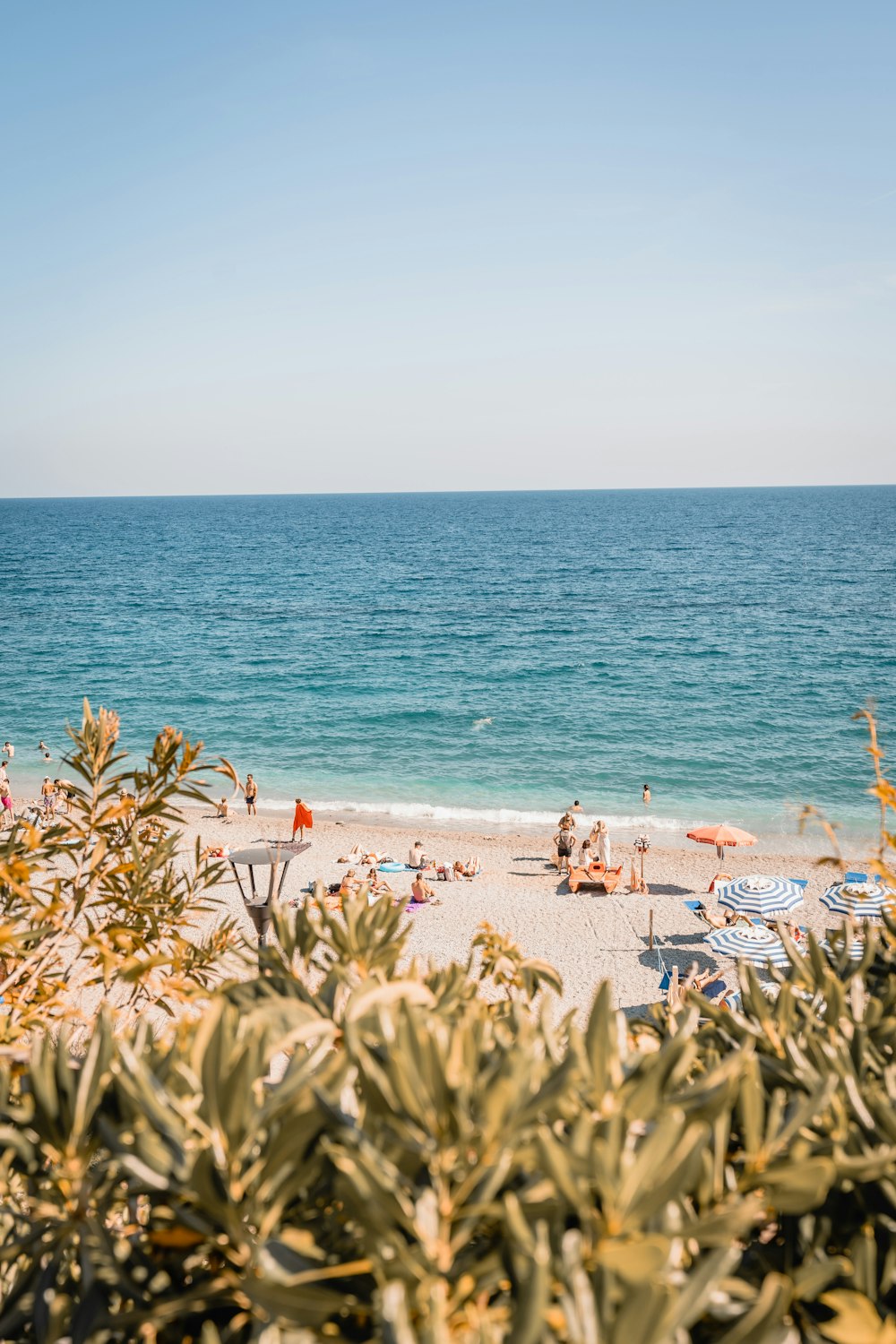 a view of a beach with a lot of people on it