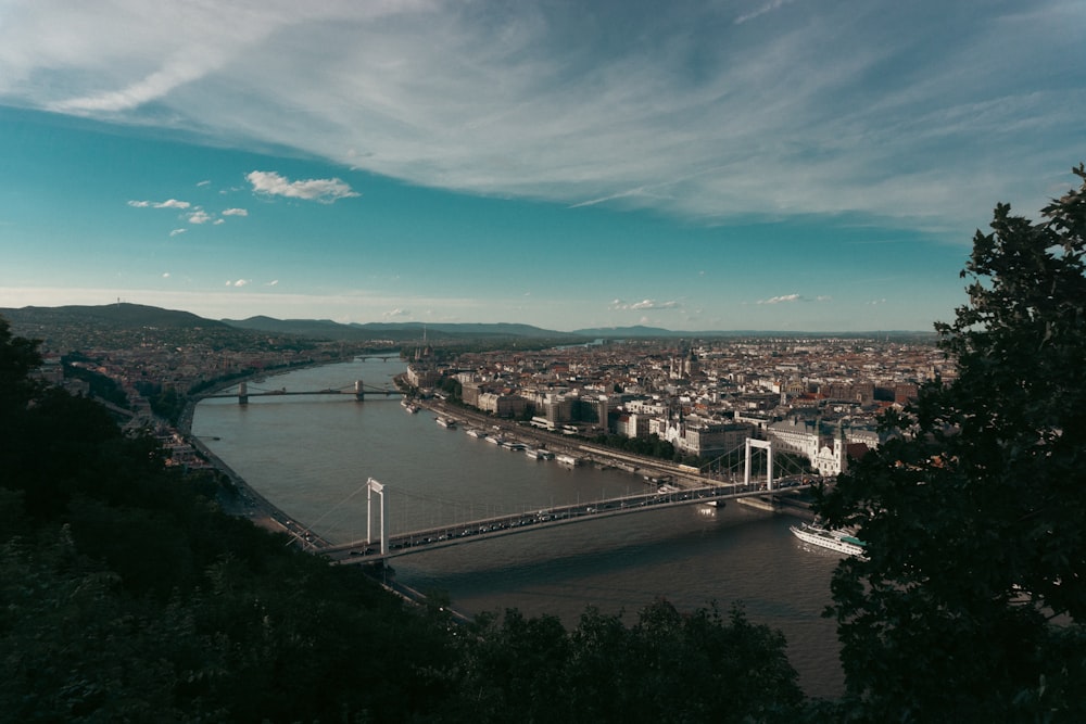 a view of a city and a bridge over a river