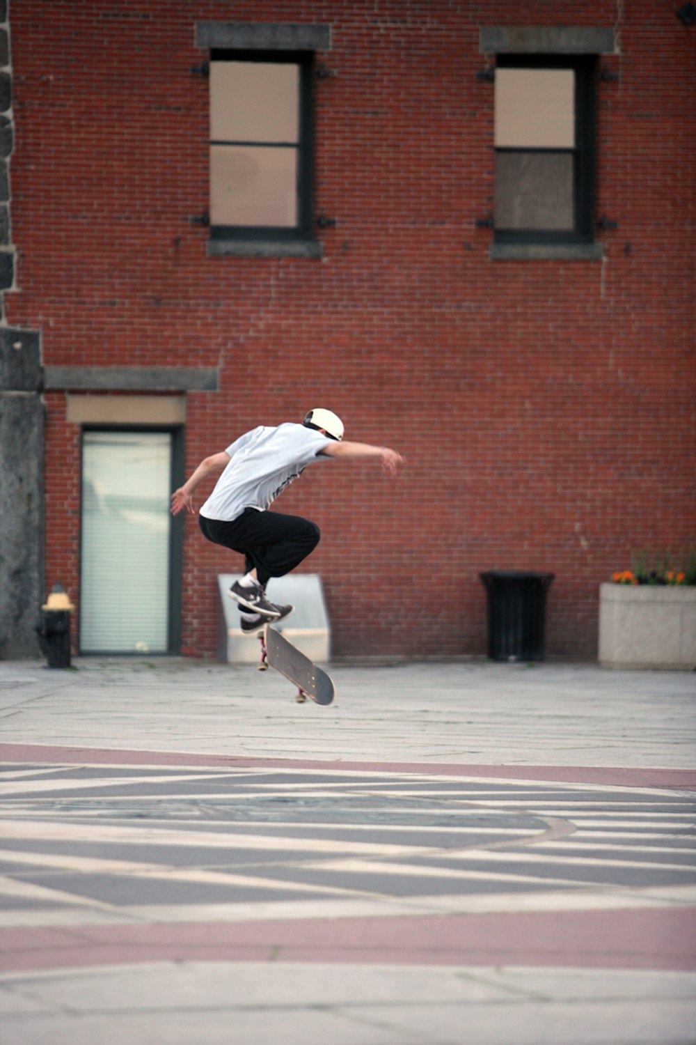 a man flying through the air while riding a skateboard