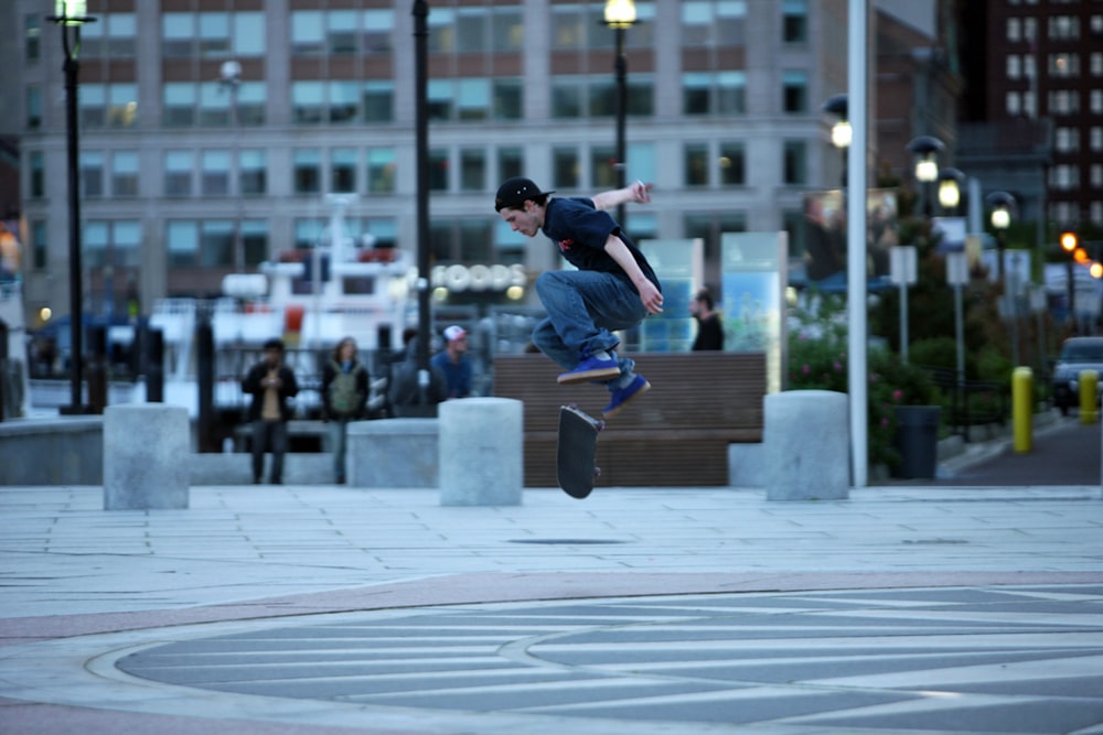 a man flying through the air while riding a skateboard