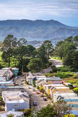 A view of a town with mountains in the background